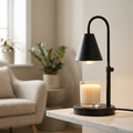 Lumio candle warmer lamp melting a cream candle on a marble shelf