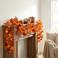 Amber Maple Lighted Fall Garland glowing along a fireplace mantel