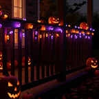Spectra Halloween LED Lights draped along a porch railing at night with pumpkins