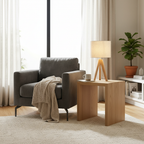 Linnea Tripod Table Lamp beside a cozy reading armchair in a sunlit living room