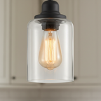 Close-up of the clear glass cylinder shade and Edison bulb