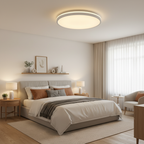Halo ceiling light glowing warm white in a cozy bedroom
