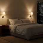 Lyra sconces glowing on either side of a bed at night