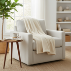 Cloudsoft throw blanket draped over a cozy reading chair by a window