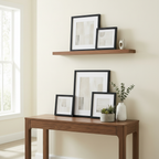 Picture frames standing on a tabletop and shelf for tabletop display